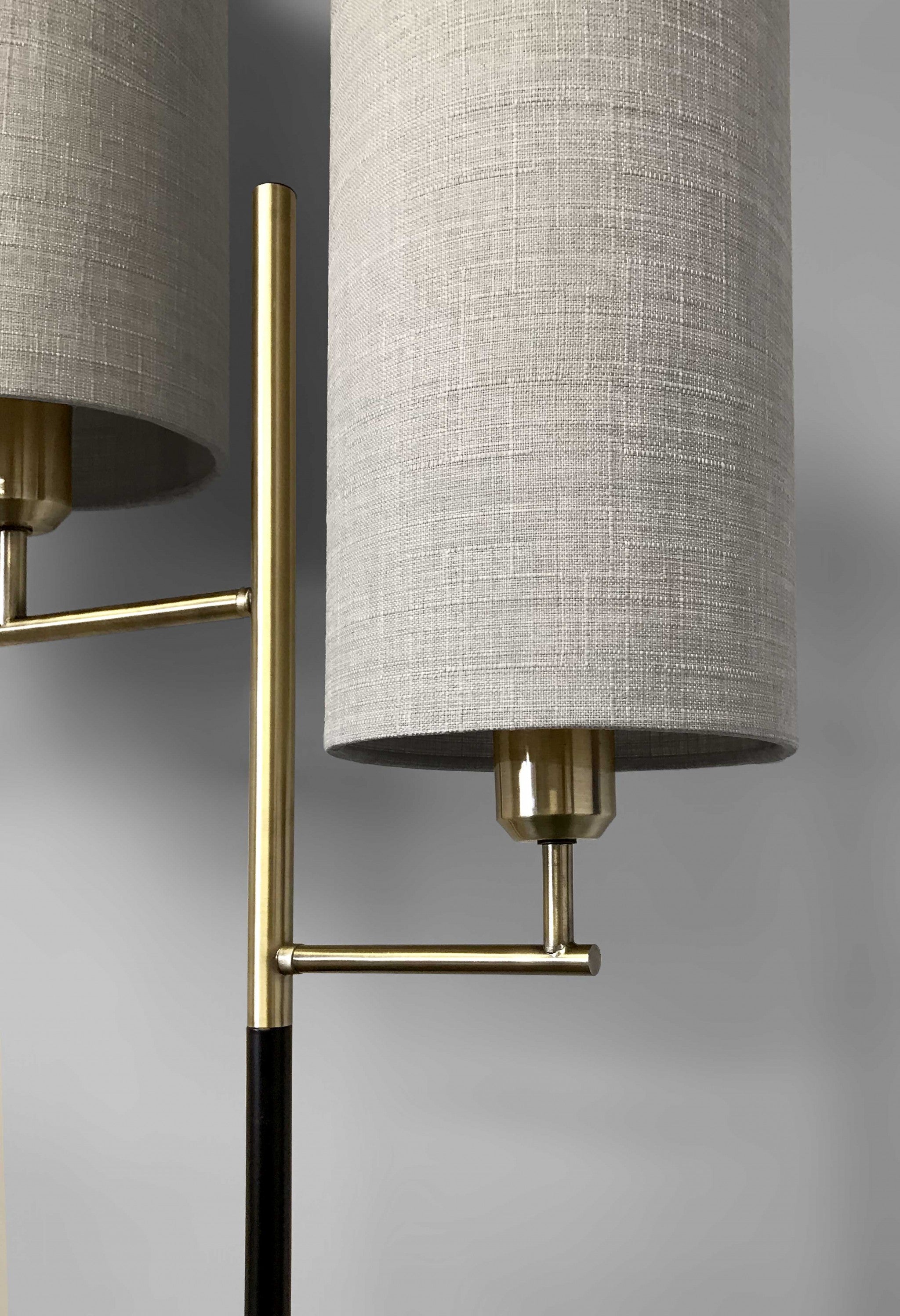 70 Brass Two Light Novelty Floor Lamp With White Drum Shade